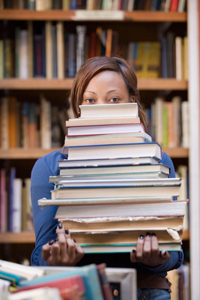 College Student with Stack of Books